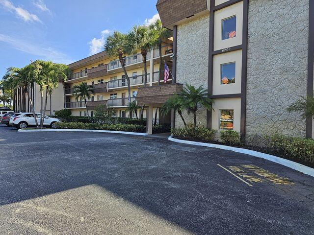 6300 Northwest 2nd Avenue, Unit 305 Boca Raton, FL 33487 - Photo 25 of 27 a front view of a building with street