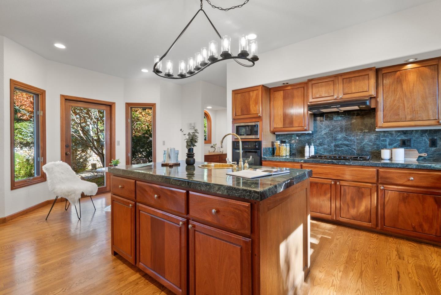 625 Quail Run Road Aptos, CA 95003 - Photo 13 of 49 a kitchen with wooden cabinets and sink