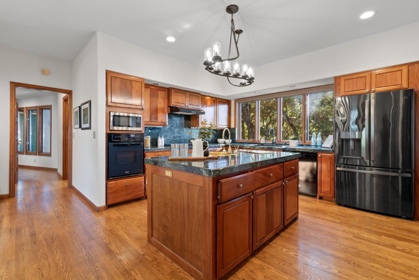625 Quail Run Road Aptos, CA 95003 - Photo 14 of 49 a kitchen with stainless steel appliances granite countertop a refrigerator and a wooden floors