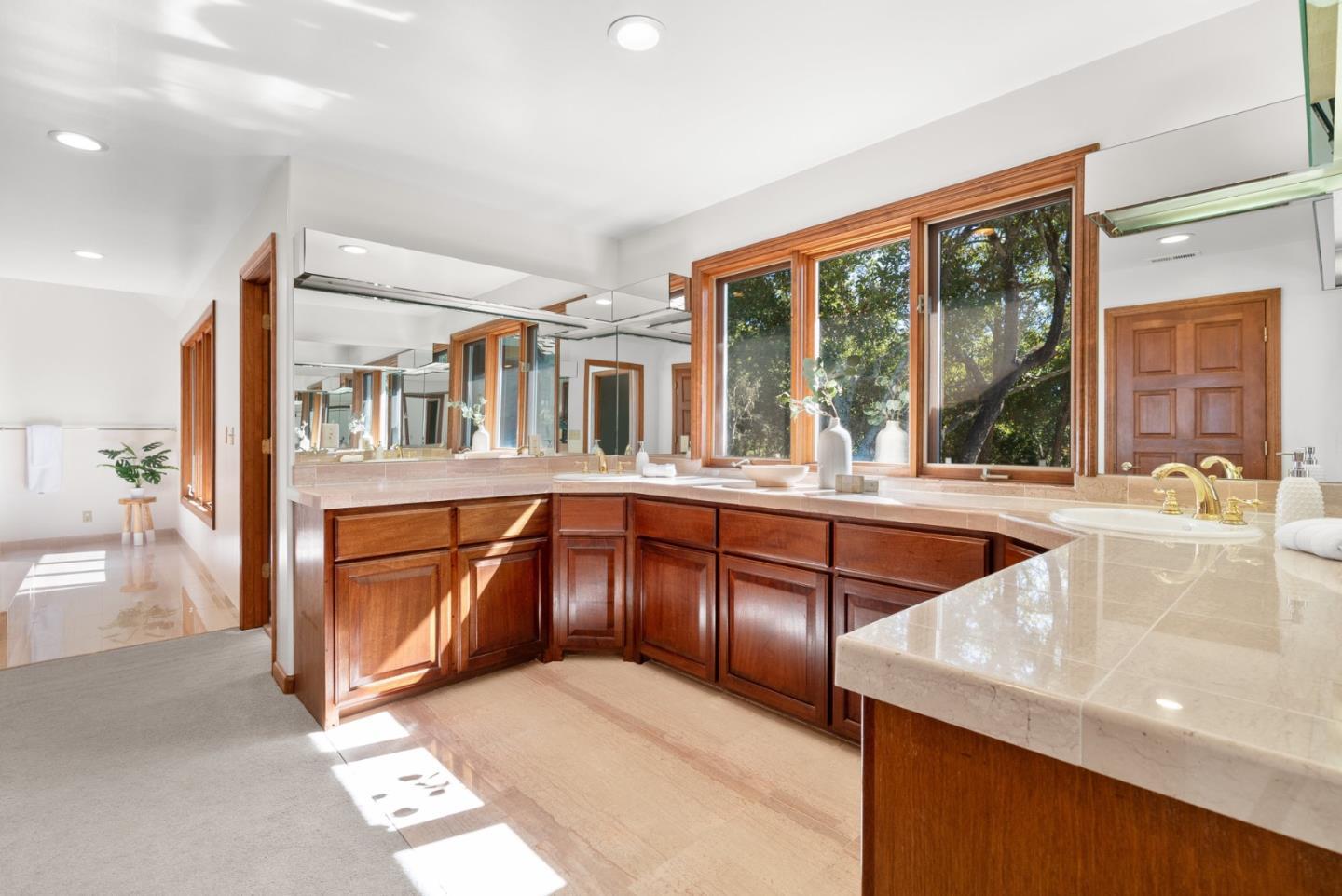 625 Quail Run Road Aptos, CA 95003 - Photo 23 of 49 a large white kitchen with granite countertop a large window and a counter space