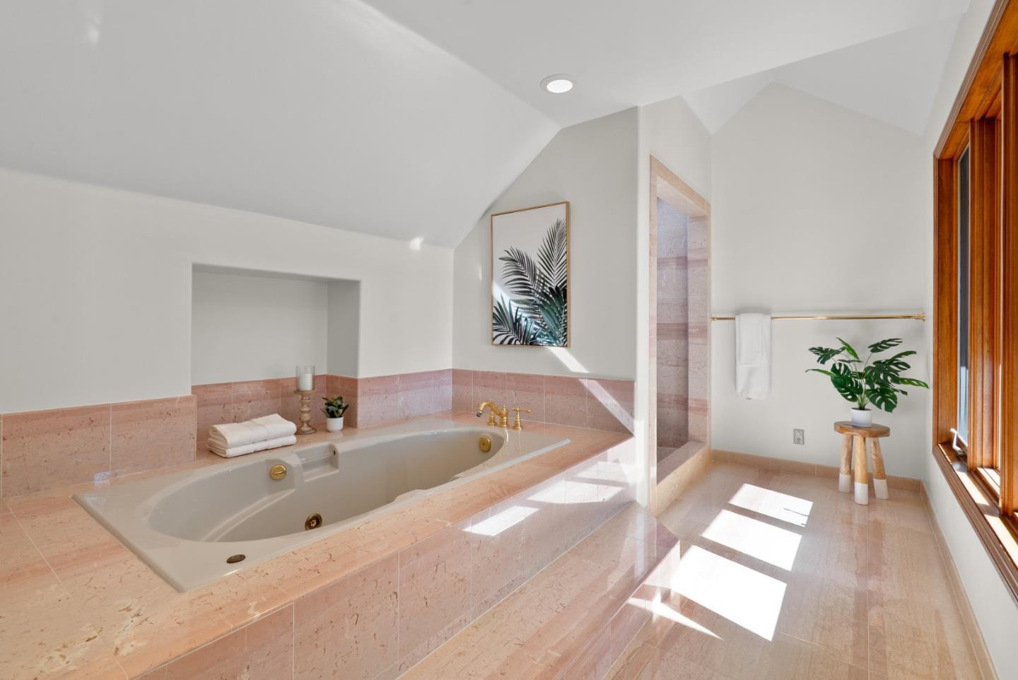 625 Quail Run Road Aptos, CA 95003 - Photo 24 of 49 a bathroom with a tub a sink and a large mirror