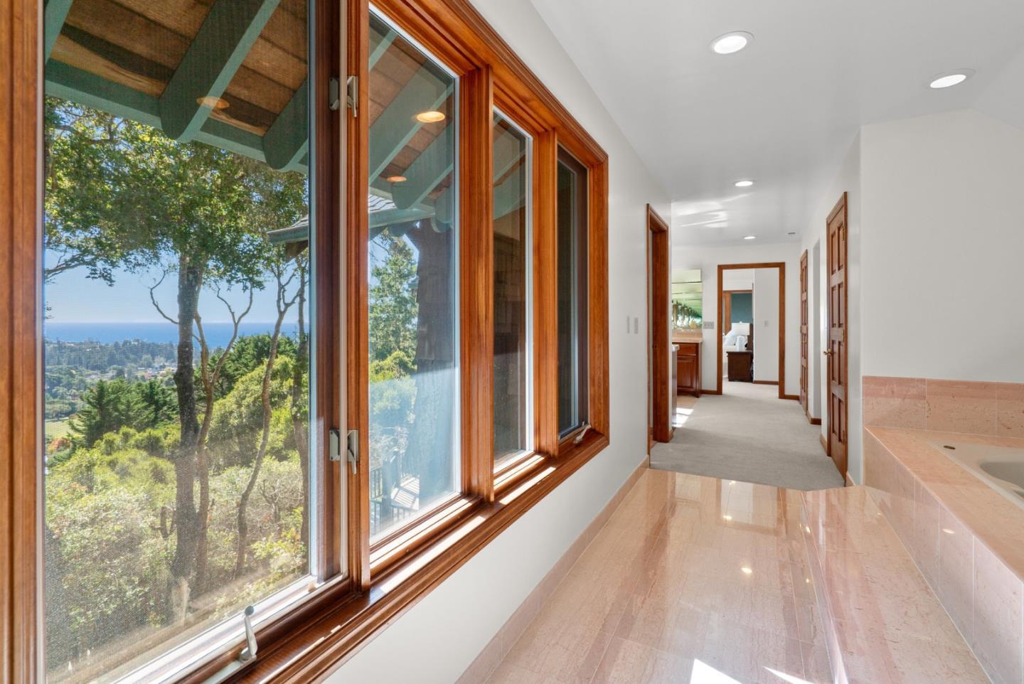 625 Quail Run Road Aptos, CA 95003 - Photo 26 of 49 a view of a hallway with wooden floor and door