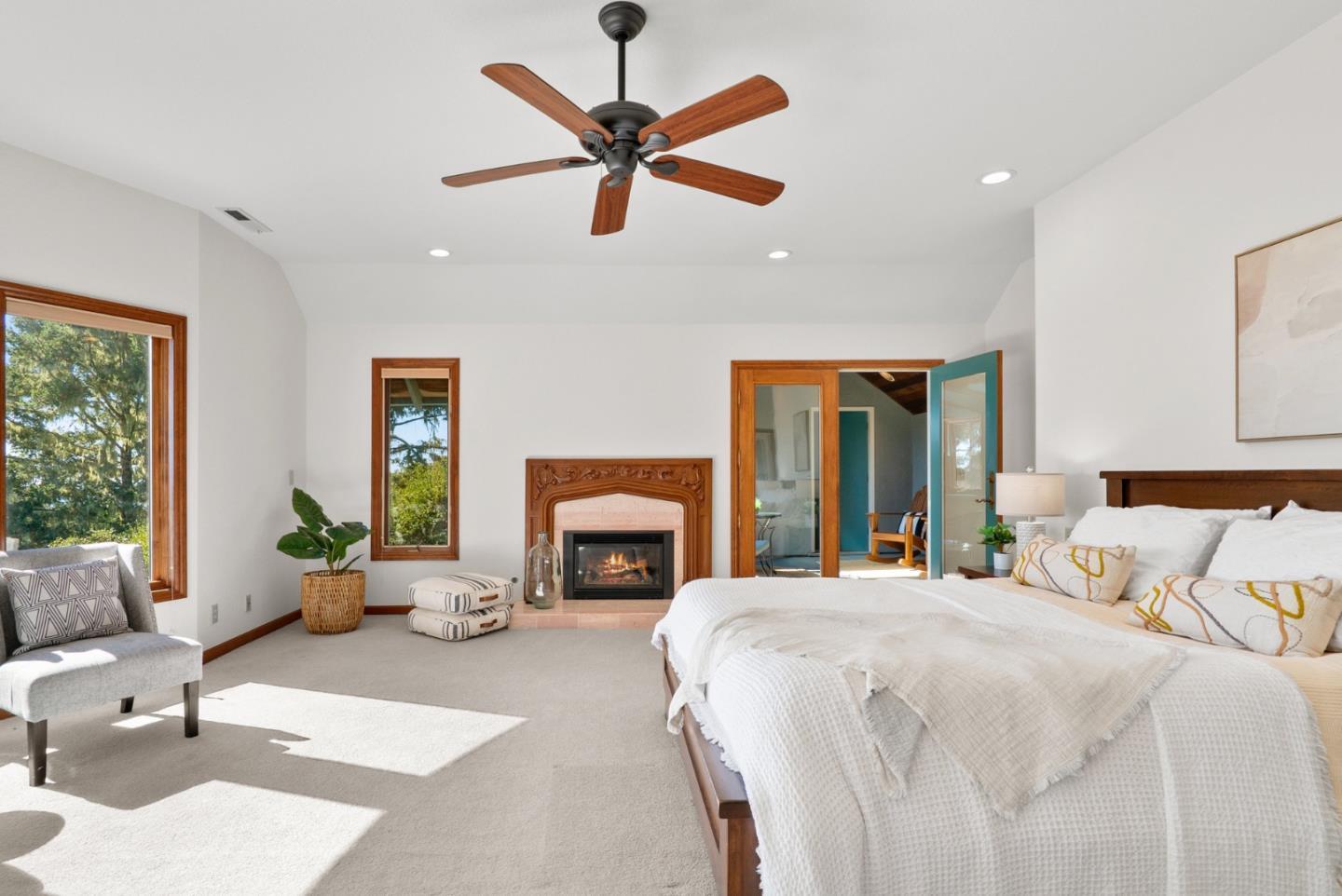 625 Quail Run Road Aptos, CA 95003 - Photo 27 of 49 a bedroom with a large bed and a fireplace