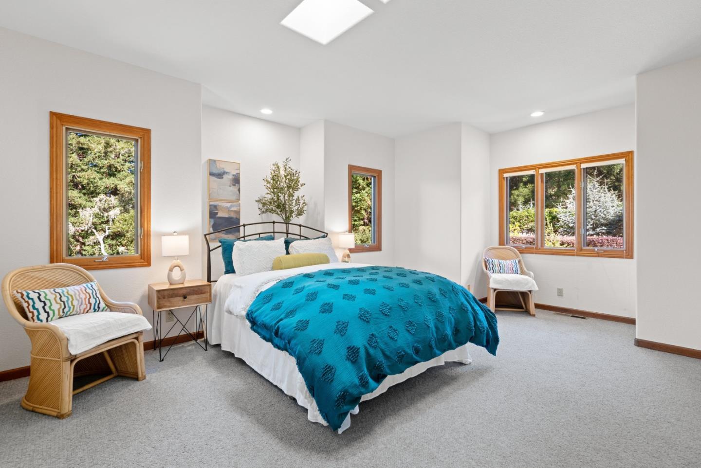 625 Quail Run Road Aptos, CA 95003 - Photo 30 of 49 a spacious bedroom with a bed and a couch