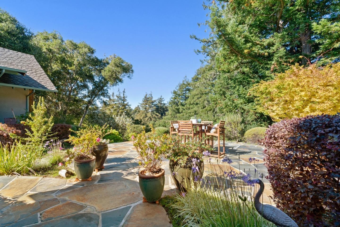 625 Quail Run Road Aptos, CA 95003 - Photo 41 of 49 a view of a patio with table and chairs and potted plants