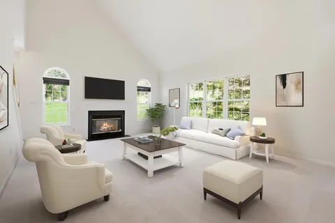 a living room with furniture and a table