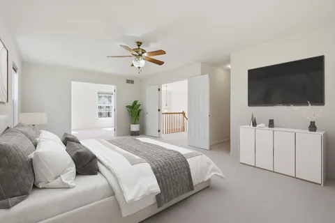 a living room with furniture and flowers