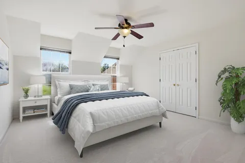 a bedroom with a large bed and a window