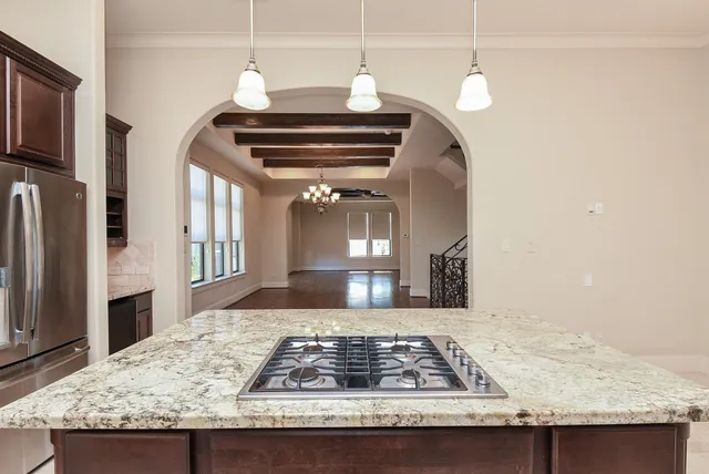 a view of living room with granite countertop furniture and fireplace