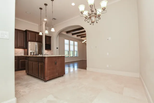 a spacious bathroom with a double vanity sink and a mirror