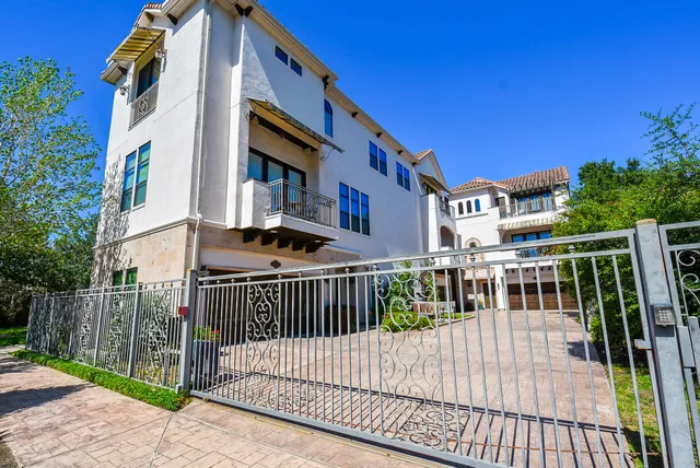 a view of a house with a small deck