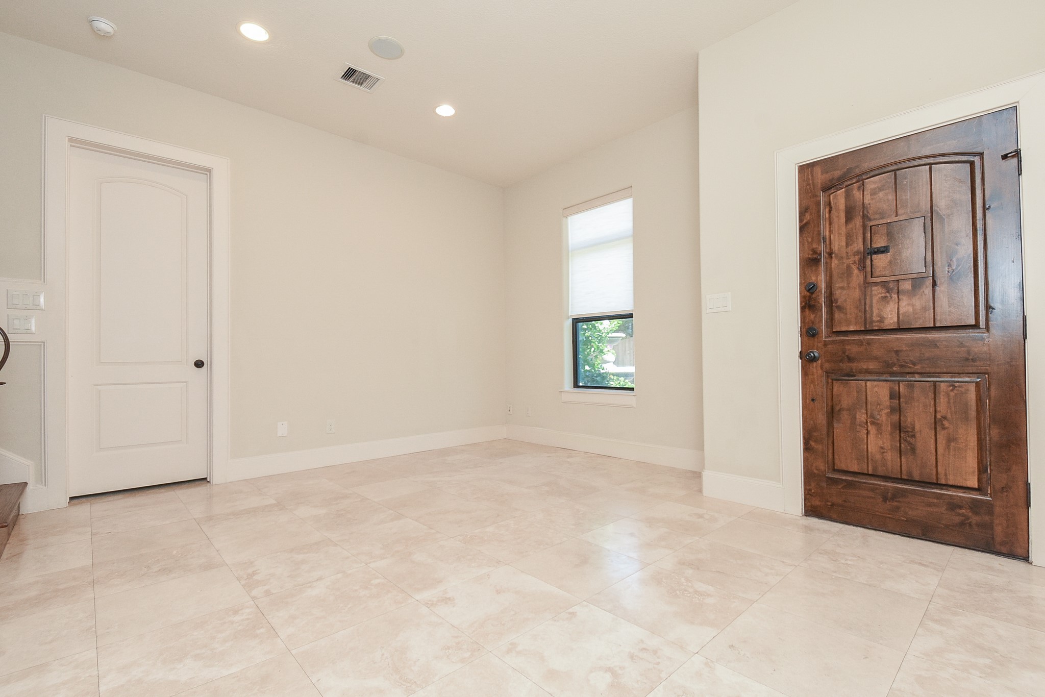 2052 West Main Street Houston, TX 77098 - Photo 3 of 32 an empty room with windows and cabinet