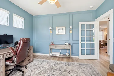 a reading room with furniture and a window