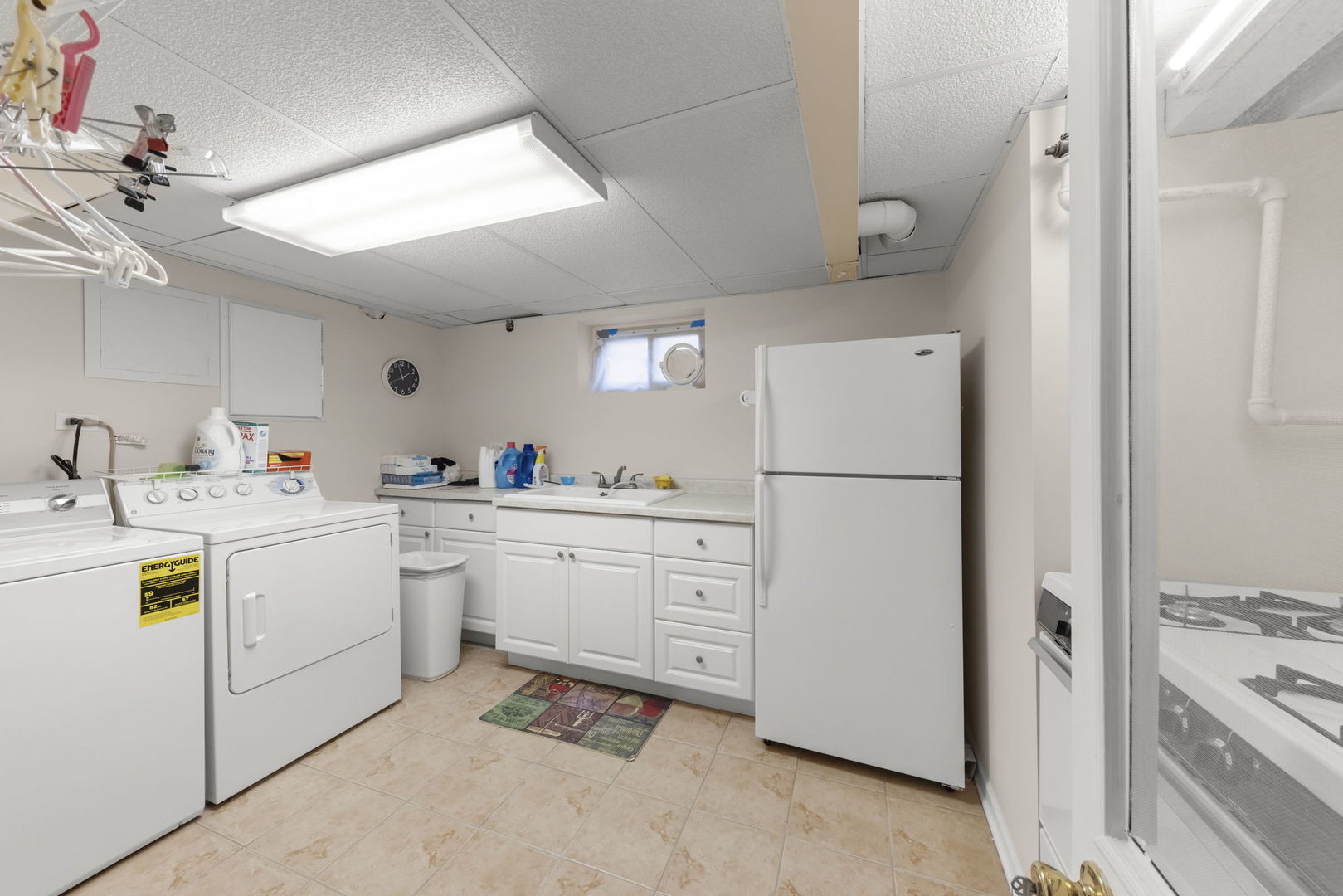 370 Oak Street Elmhurst, IL 60126 - Photo 21 of 35 a kitchen with a refrigerator and white cabinets