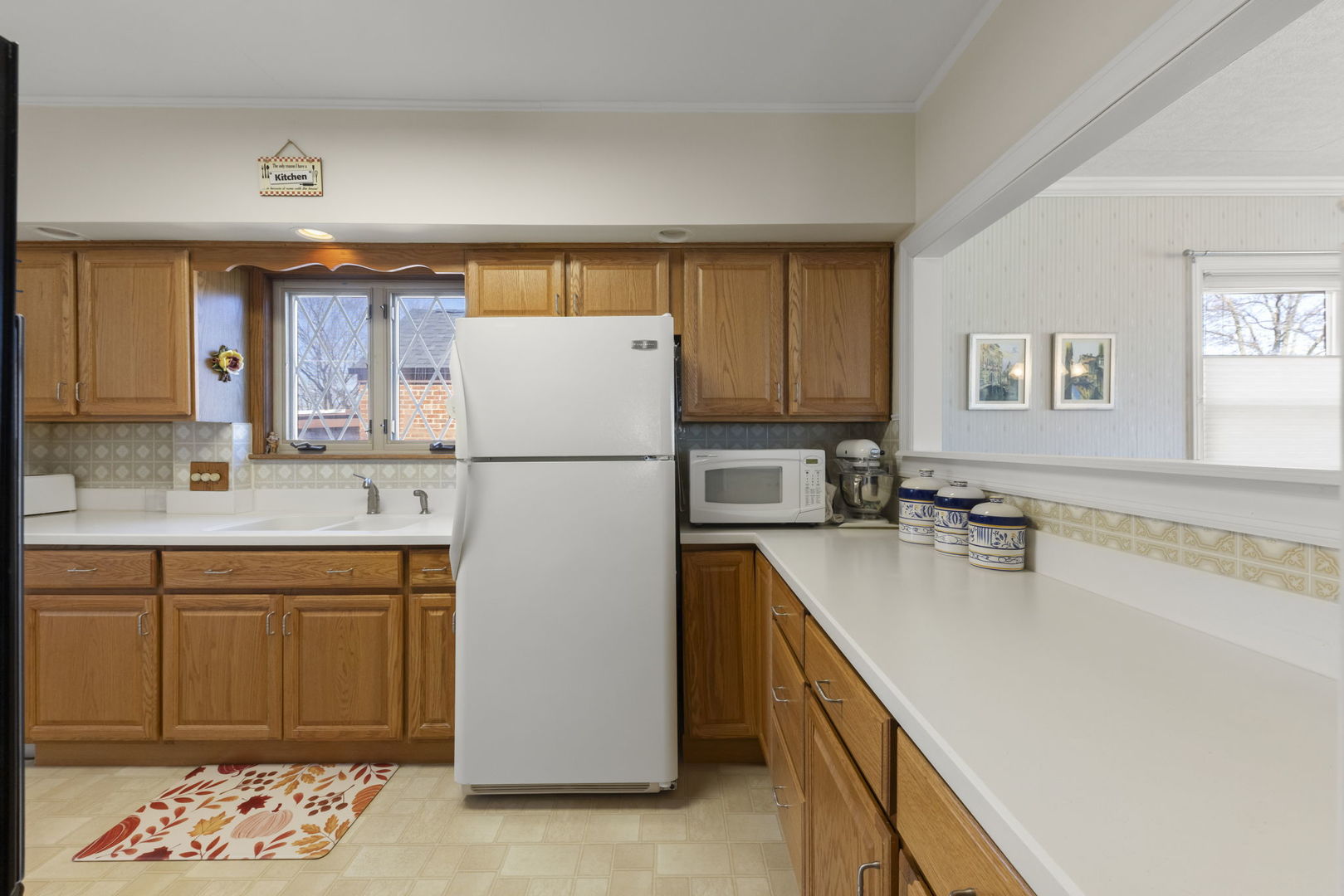 370 Oak Street Elmhurst, IL 60126 - Photo 8 of 35 a kitchen with a refrigerator a sink and cabinets
