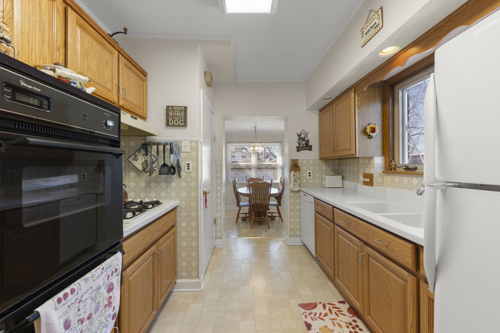 370 Oak Street Elmhurst, IL 60126 - Photo 9 of 35 a kitchen with stainless steel appliances granite countertop a refrigerator and a stove
