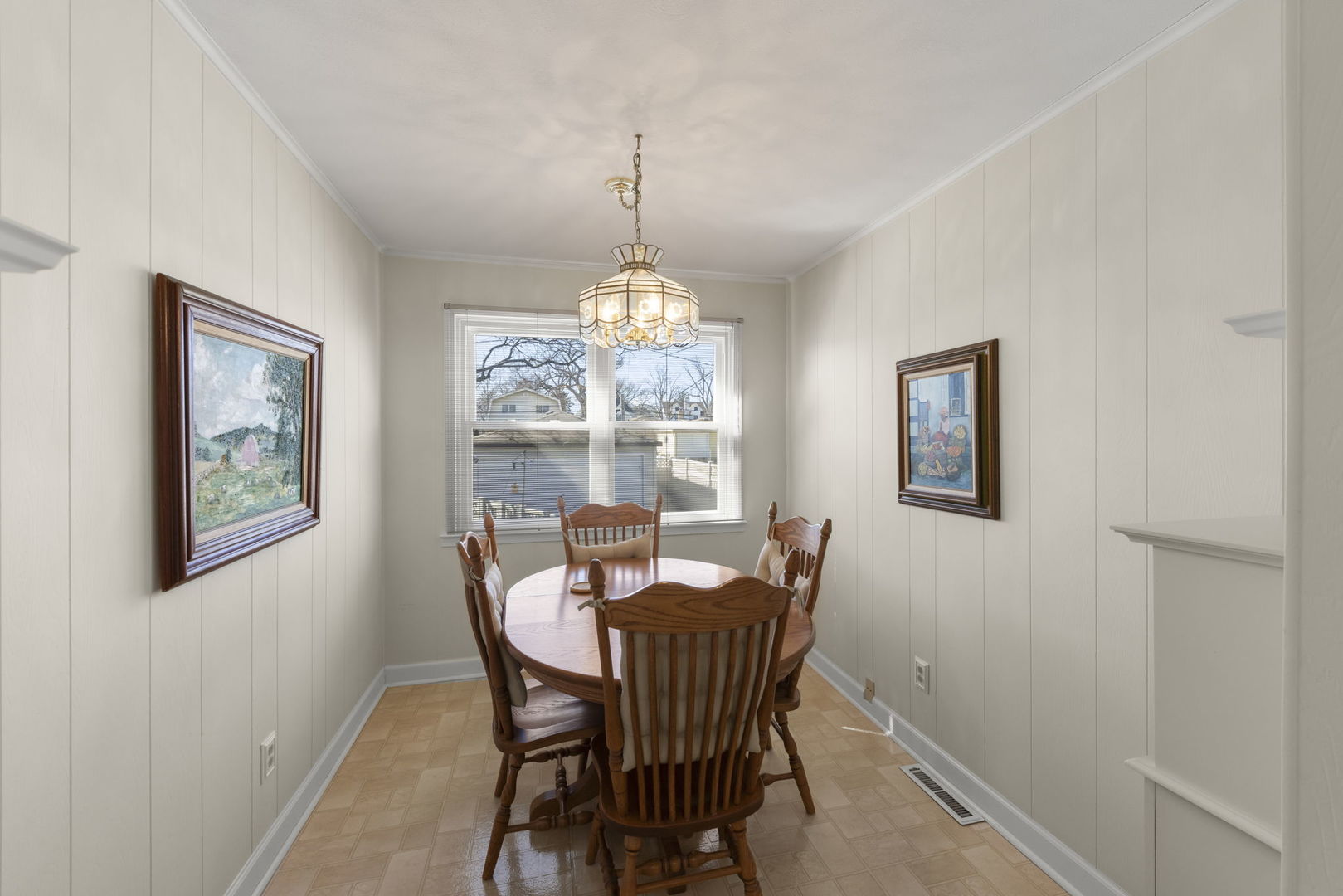 370 Oak Street Elmhurst, IL 60126 - Photo 10 of 35 a dining room with furniture a chandelier and window