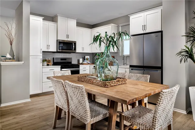 a bedroom with bed and a potted plant