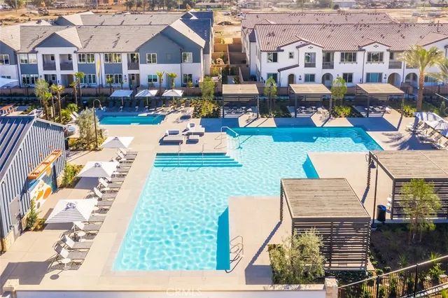 a view of swimming pool with outdoor seating