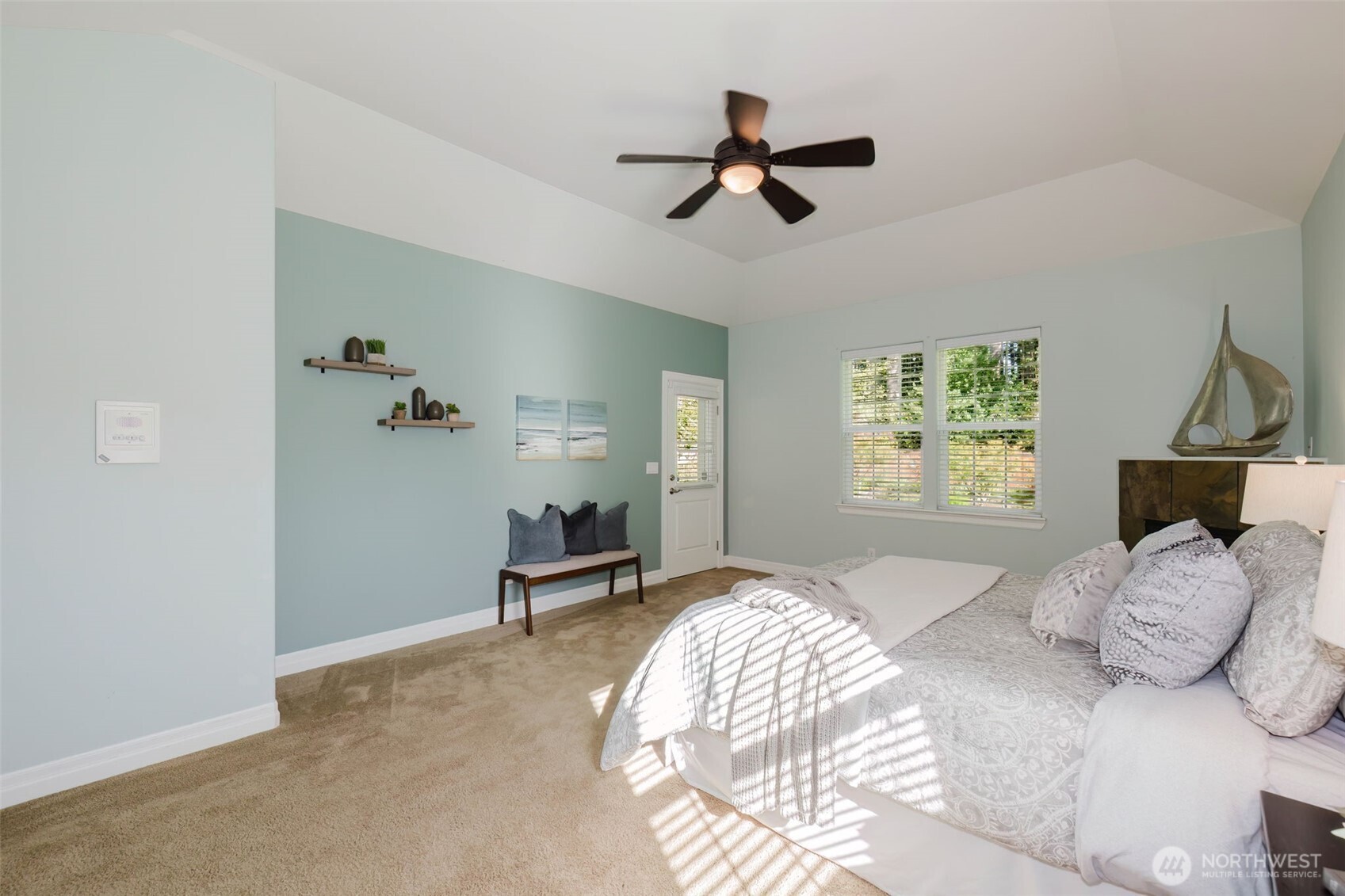 14113 84th Ave Court Northwest Gig Harbor, WA 98329 - Photo 16 of 40 a bedroom with a bed and a chandelier