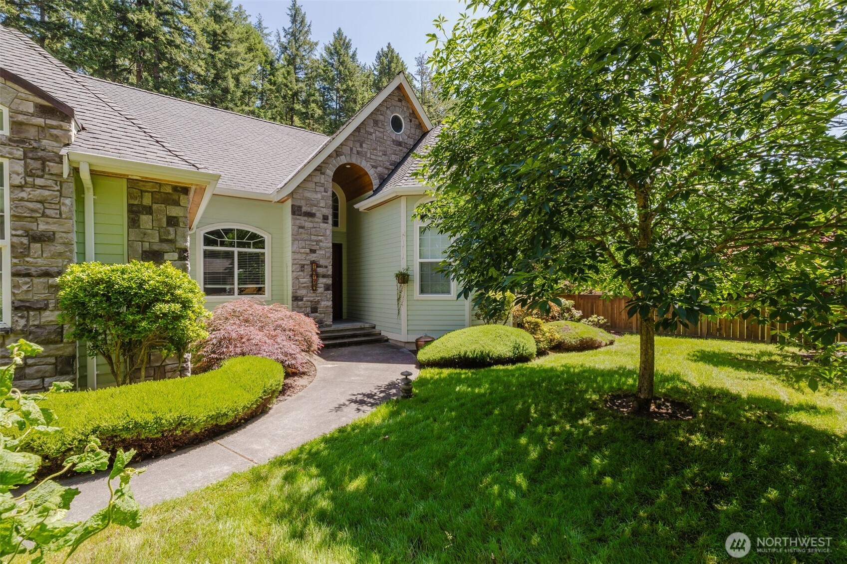 14113 84th Ave Court Northwest Gig Harbor, WA 98329 - Photo 2 of 40 a view of a house with big yard and potted plants