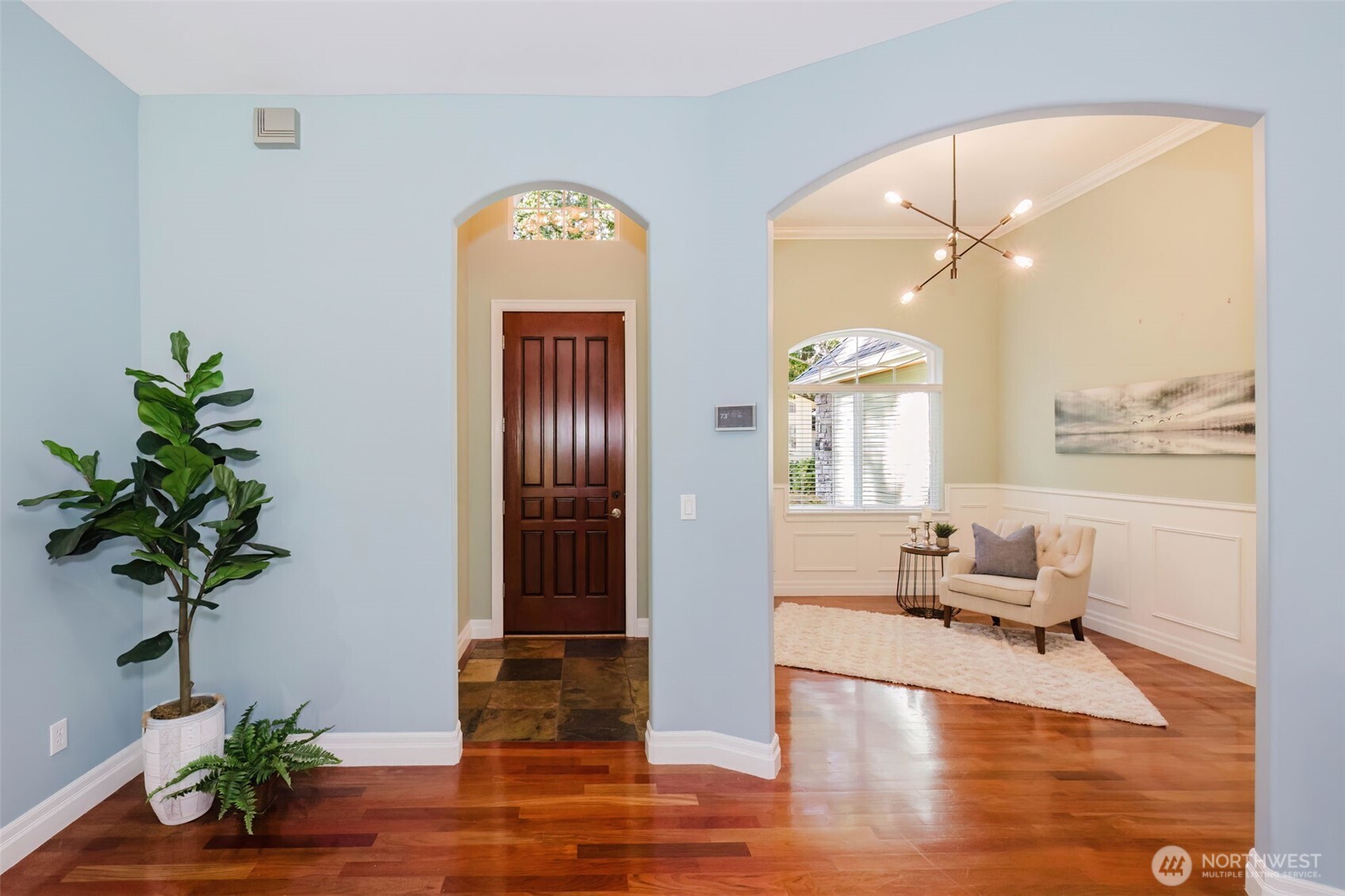 14113 84th Ave Court Northwest Gig Harbor, WA 98329 - Photo 3 of 40 a living room with furniture and a potted plant