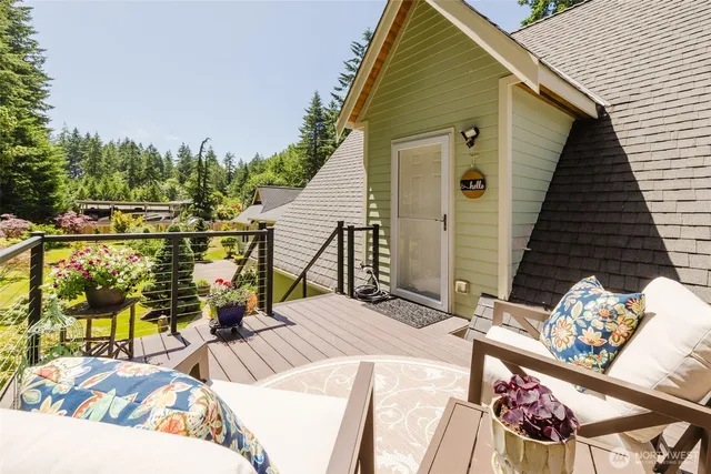 a living room with stainless steel appliances kitchen island granite countertop furniture and a dining table with kitchen view