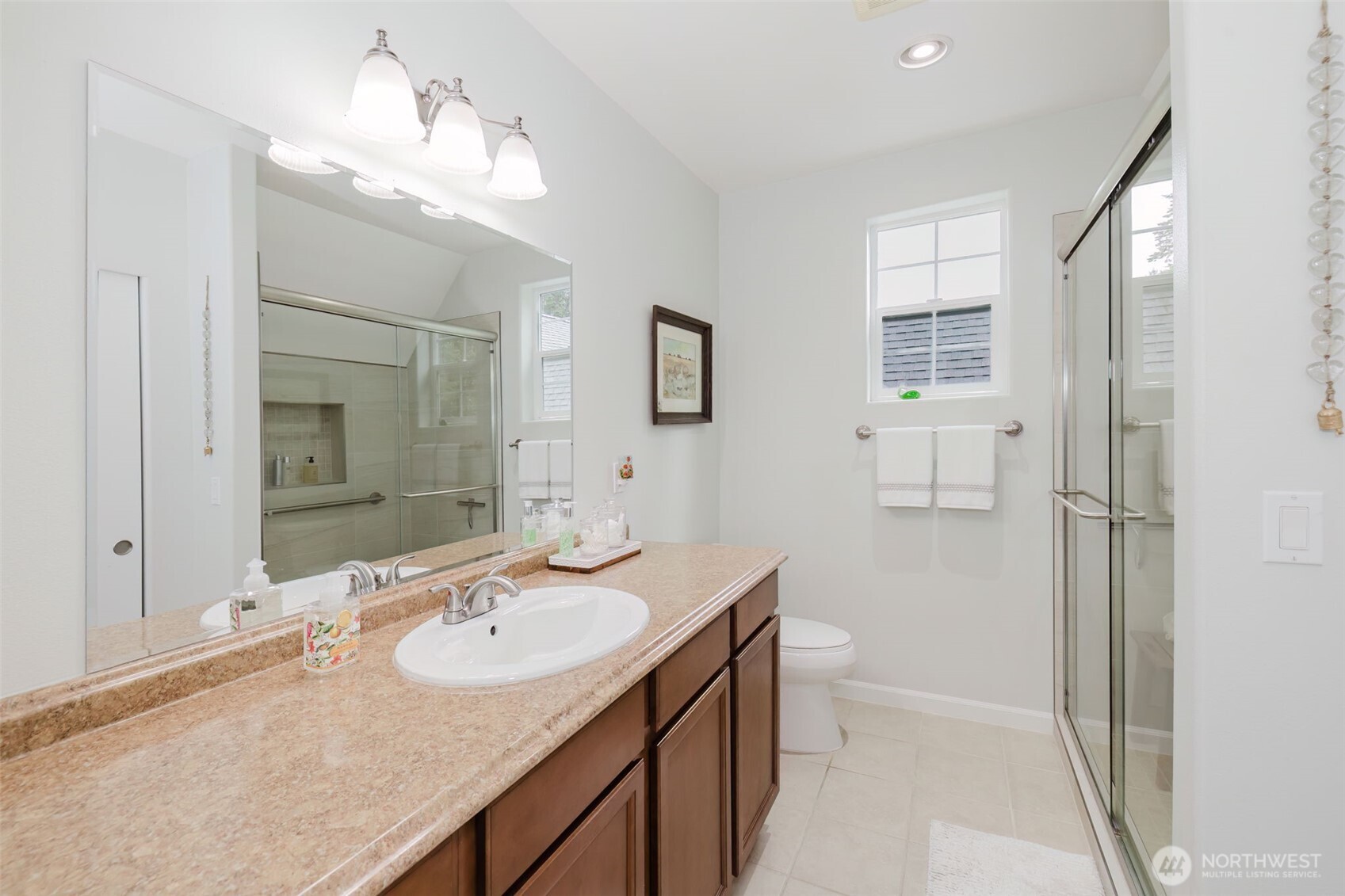 14113 84th Ave Court Northwest Gig Harbor, WA 98329 - Photo 37 of 40 a bathroom with a sink double vanity granite and a mirror