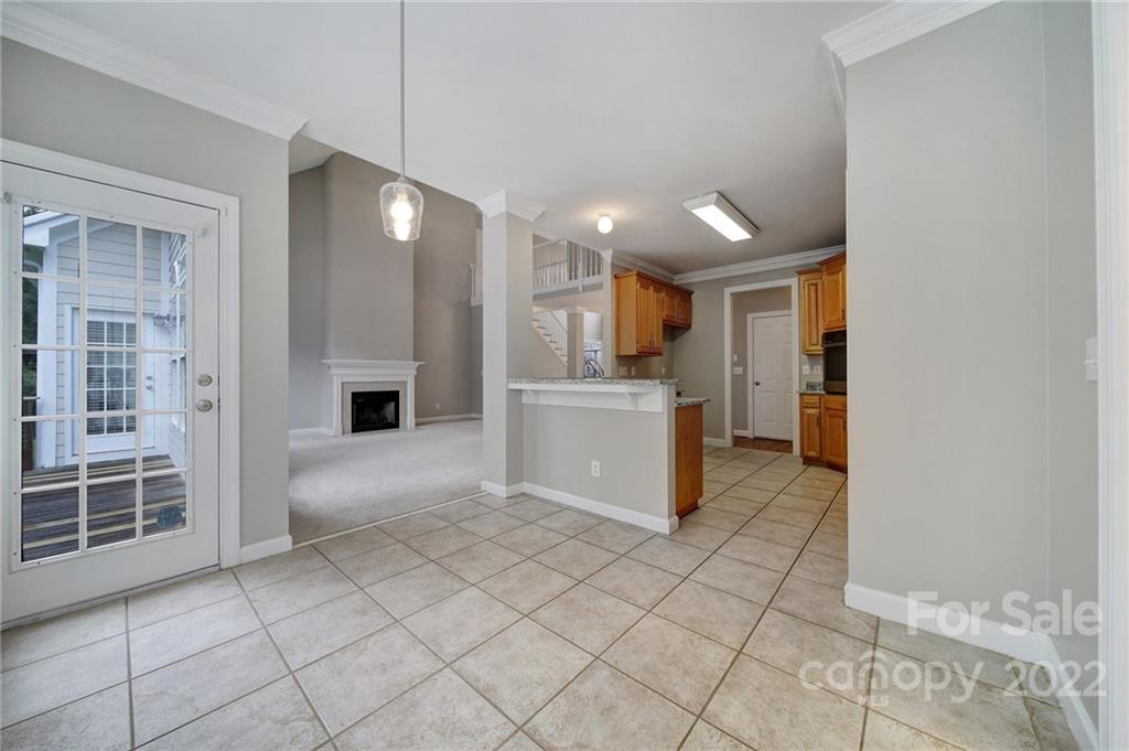 1711 Copperplate Road Charlotte, NC 28262 - Photo 14 of 48 a view of a kitchen with furniture and an empty room