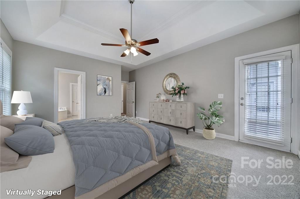 1711 Copperplate Road Charlotte, NC 28262 - Photo 20 of 48 a bedroom with a large bed and a window