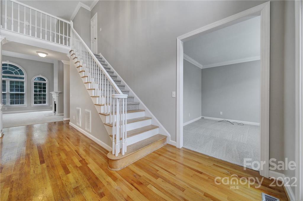 1711 Copperplate Road Charlotte, NC 28262 - Photo 2 of 48 a view of entryway and hall with wooden floor