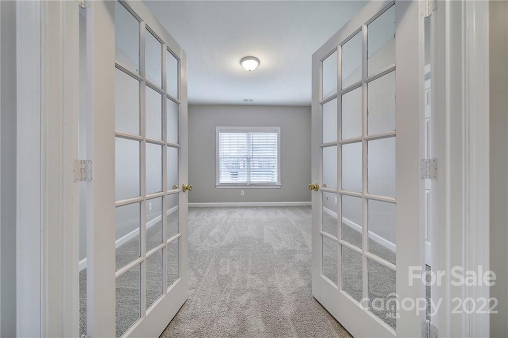 1711 Copperplate Road Charlotte, NC 28262 - Photo 28 of 48 a view of an empty room with a window