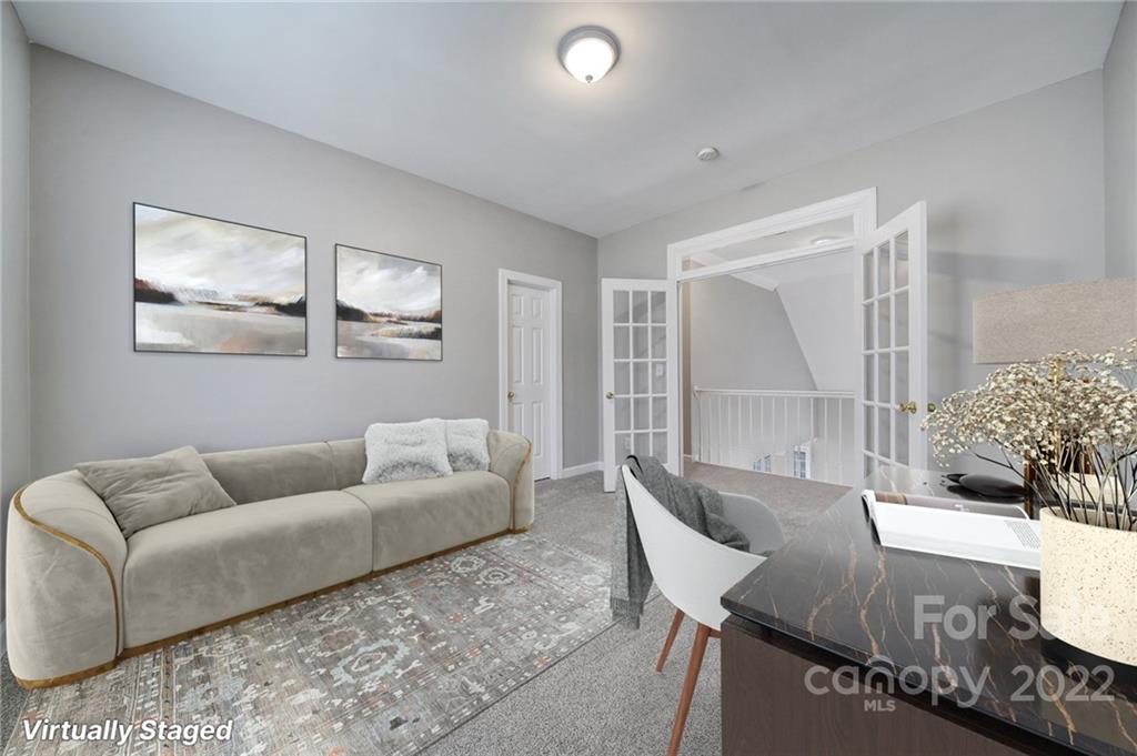 1711 Copperplate Road Charlotte, NC 28262 - Photo 29 of 48 a living room with furniture and a large window