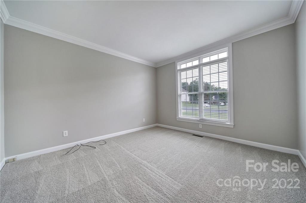 1711 Copperplate Road Charlotte, NC 28262 - Photo 3 of 48 an empty room with a window