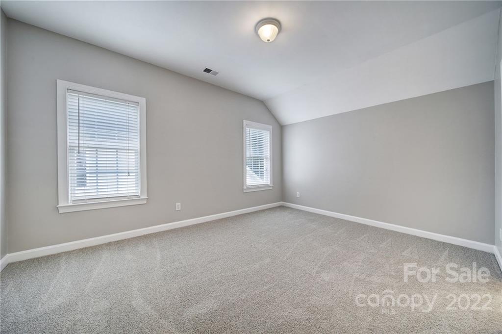1711 Copperplate Road Charlotte, NC 28262 - Photo 34 of 48 an empty room with a window