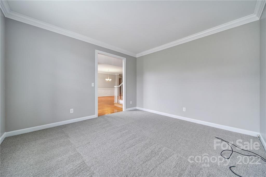 1711 Copperplate Road Charlotte, NC 28262 - Photo 4 of 48 a view of an empty room with wooden floor