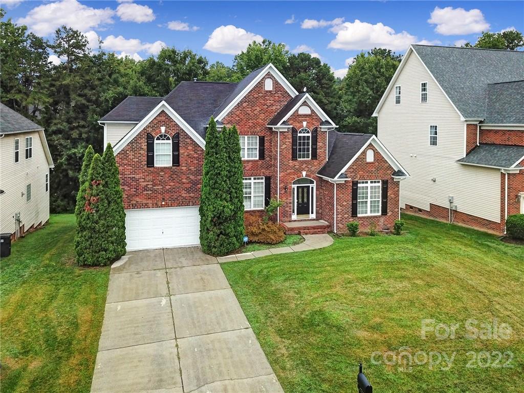 1711 Copperplate Road Charlotte, NC 28262 - Photo 41 of 48 a front view of a house with a yard