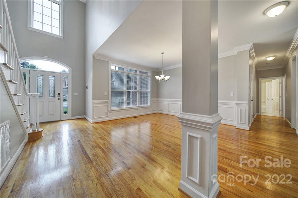 1711 Copperplate Road Charlotte, NC 28262 - Photo 8 of 48 wooden floor in an empty room with a fireplace