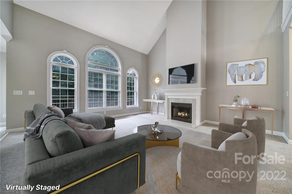 1711 Copperplate Road Charlotte, NC 28262 - Photo 9 of 48 a living room with furniture windows and a fireplace