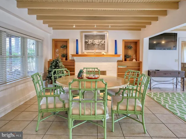 a dining room with furniture and window