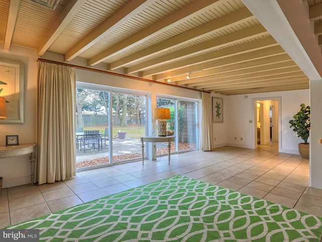 a living room with furniture and a gate