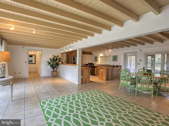 a bedroom with a large bed and a flat screen tv