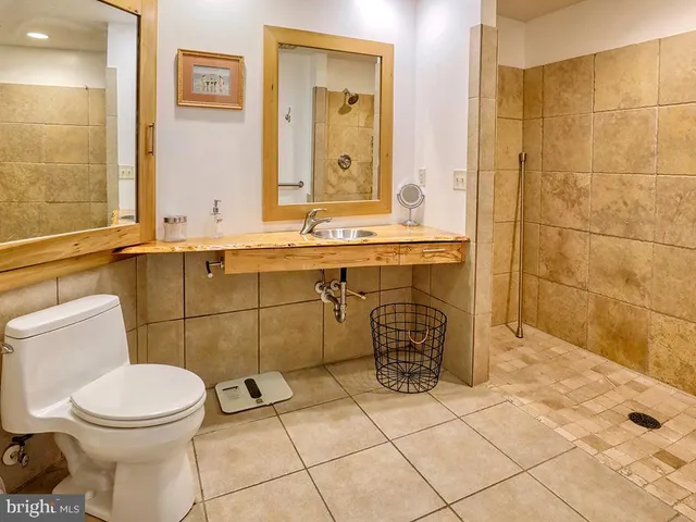 a room with washing machine and cabinets