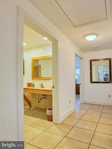 a kitchen with a refrigerator and cabinets