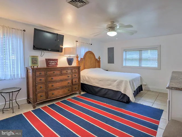 a view of a house with a yard patio and fire pit