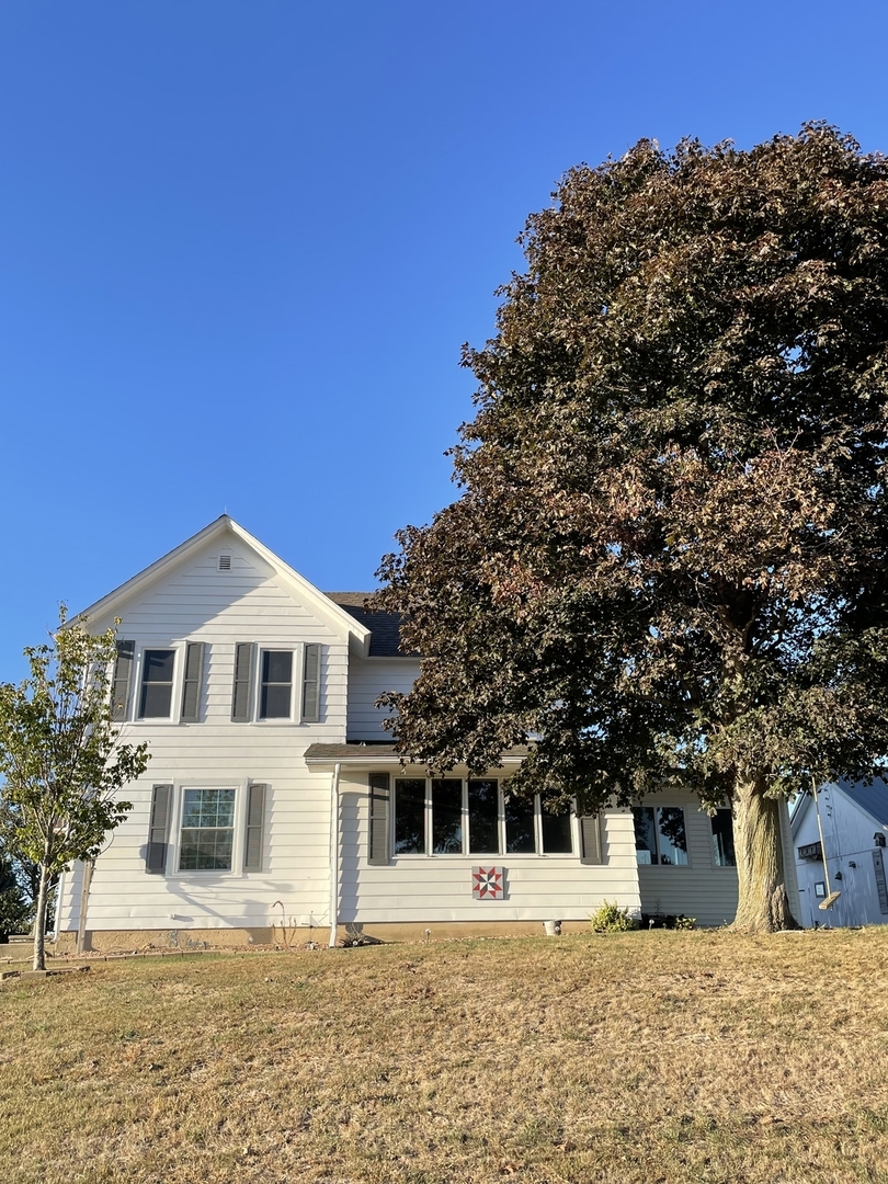 18221 Fairhaven Road Chadwick, IL 61014 - Photo 1 of 20 a front view of a house with a yard