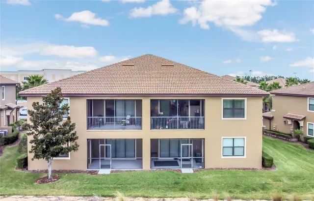 a view of a house with a yard and plants