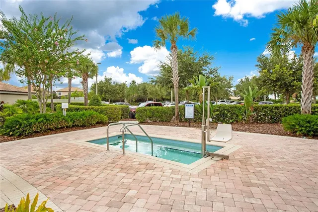 a view of a swimming pool with a yard