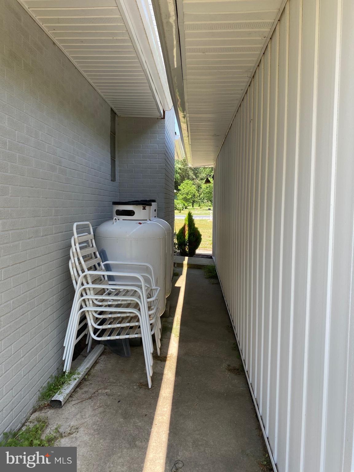 7573 Shawnee Road Milford, DE 19963 - Photo 3 of 25 Walkway between garage and house