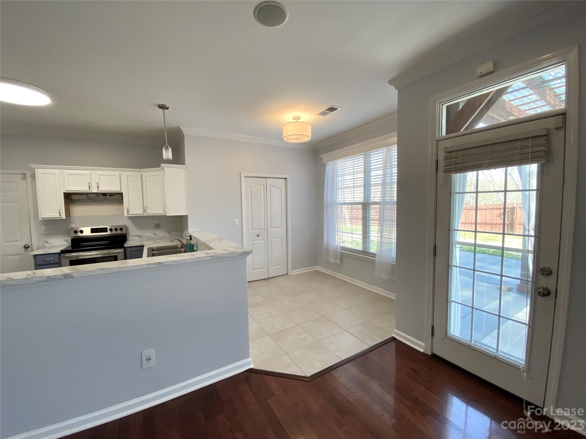 161 Mott Road Mooresville, NC 28115 - Photo 11 of 27 a view of kitchen with furniture and wooden floor